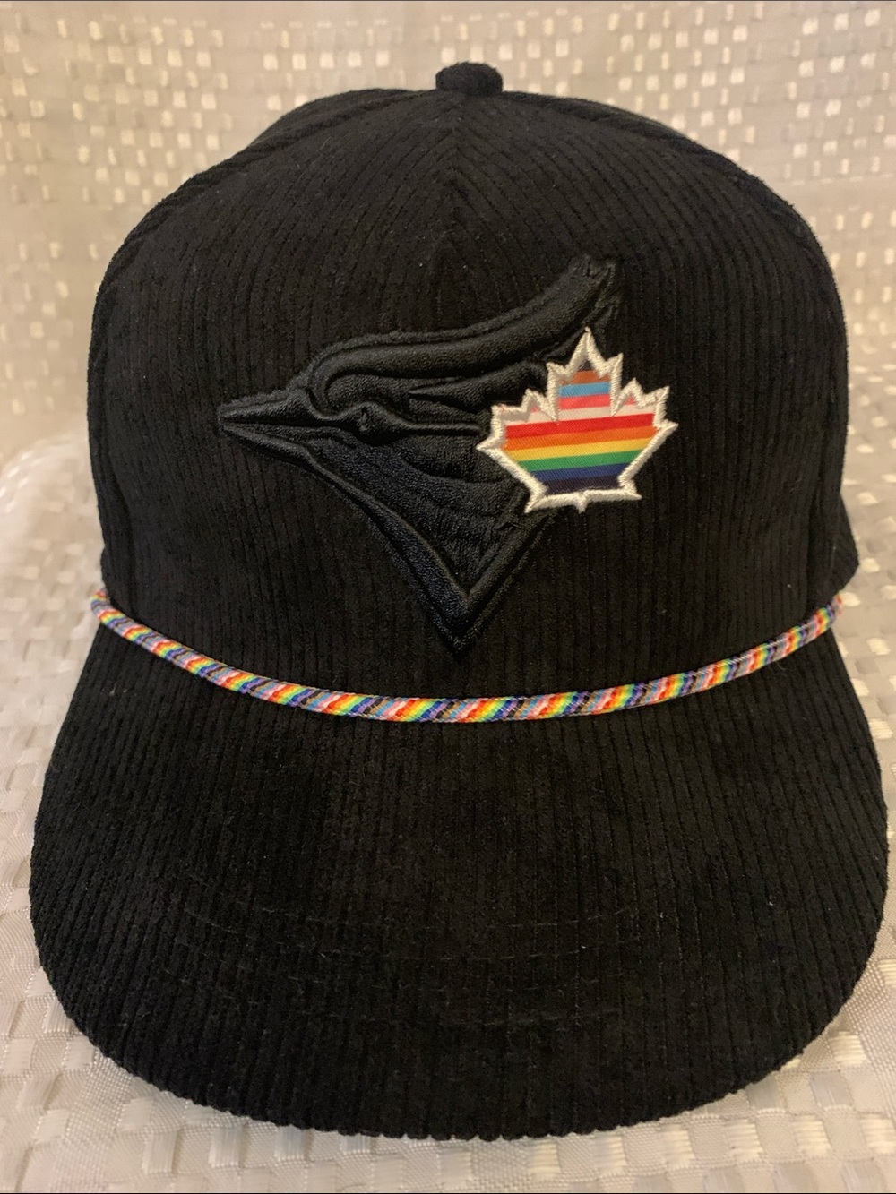 Toronto Blue Jays Black Corduroy Hat with Pride Rainbow Maple Leaf Patch.